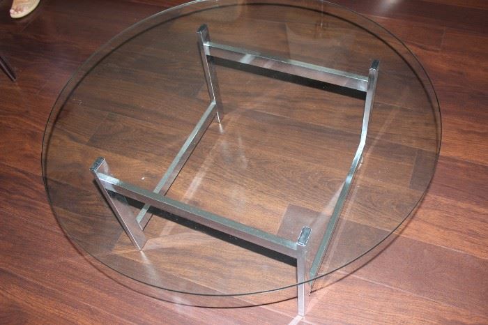 Round glass and chrome coffee table.