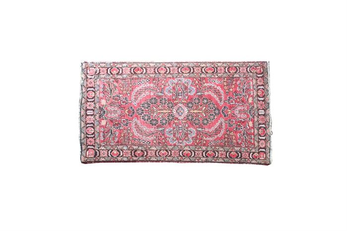 Bashiran Hand Woven Persian Wool Rug: A Bashiran hand woven wool rug. This rug features an all over floral and foliate pattern, in hues of crimson, blue, taupe, pink, and orange. A tag is present to the verso “Bashiran Genuie Oriental rugs – Super Lilahan Kanape, Made in Persia”.