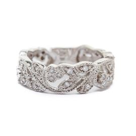 10K White Gold Diamond Filigree Ring: A 10K white gold diamond filigree ring. This ring features a pierced floral design with milgrain detailing.