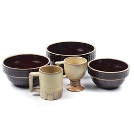 Mid Century Ceramic Tableware Including Frankoma: A collection of mid century tableware. The collection includes two Frankoma mugs with dessert sand glaze and a set of three brown glaze stoneware nesting bowls marked “USA” to the underside.