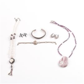 Sterling Silver and 800 Silver Jewelry with Gemstones: An assortment of sterling silver and 800 silver jewelry with gemstones. This selection includes an 800 silver necklace with glass and cultured pearl beads and a lepidolite pendant. Also included, a pair of sterling silver floral filigree earrings with hinged earwires, a sterling silver cuff bracelet with a rope motif, a sterling silver necklace with cultured pearl, quartz crystal tumbled and faceted beads and an agate cabochon pendant, and more. The sterling silver items are either hallmarked or tested as sterling silver and the total weight, inclusive of all materials, is 3.425 ozt. The total approximate weight of the 800 silver necklace is 1.750 ozt.