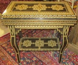 Intricately inlaid game table