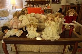 Darling and delightful dolls everywhere and a beautiful sofa table