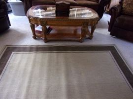 Glass top coffee table and area rug