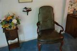 Vintage smoking stand and leather chair with nailhead trim.