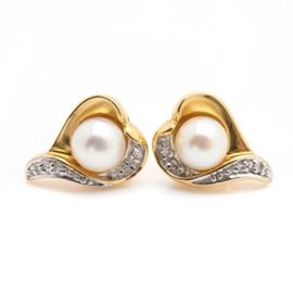 18K Yellow Gold Pearl and Diamond Earrings: A pair of 18K yellow gold cultured pearl and diamond earrings. These earrings feature a center cultured pearl with freeform bead set diamonds mounted in a heart motif setting.