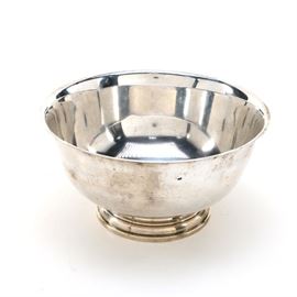 Cartier "Paul Revere Reproduction" Sterling Silver Bowl: A Paul Revere Reproduction sterling silver bowl by Cartier. It features a round bowl with a footed base. The approximate weight is 26.660 ozt.