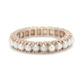 14K Yellow Gold Pearl Ring: A 14K yellow gold pearl ring. This ring features a row of cultured pearls surrounding the shank.