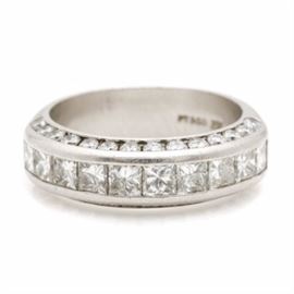 Platinum 2.45 CTW Diamond Ring: A platinum 2.45 ctw diamond ring. This ring showcases ten princess cut set across the crown accented by twenty-eight round brilliant cut diamonds adorned along the sides.