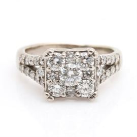 14K White Gold 1.05 CTW Diamond Ring: A 14K white gold 1.05 ctw diamond ring. Diamond encrusted split shoulders and an openwork under gallery support a square shaped crown of round brilliant cut diamonds.