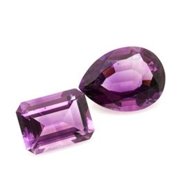 Loose 25.98 CTW Amethyst Gemstones: A 14.97 ct loose amethyst and a 11.01 ct loose amethyst.