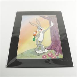 Robert McKimson Limited Edition Animation Cel "Vintage Bugs": A limited edition, hand-painted animation cel titled Vintage Bugs by animation artist, Robert McKimson. This piece depicts beloved cartoon character, Bugs Bunny leaning against a tree while munching on a carrot. It is numbered “209/750” by hand in black ink to the lower center margin. It is signed by hand in gold tone ink and marked with an official seal to the lower left corner. This work is matted in black and presented unframed in a protective acetate sleeve. Affixed to the verso is a hand inscribed certificate of authenticity from McKimson Productions Inc.