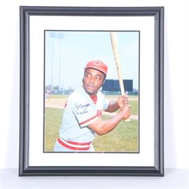 Joe Morgan Autographed Photograph: An autographed photograph of former Major League Baseball player Joe Morgan (1943 – ). This photo captures Morgan at bat in a Cincinnati Reds uniform. It is signed in ink and inscribed 75-76 MVP. This print is presented under layered mats and glass, in a black tone wood composite frame, with hanging wire and a certificate of authenticity affixed to the verso.