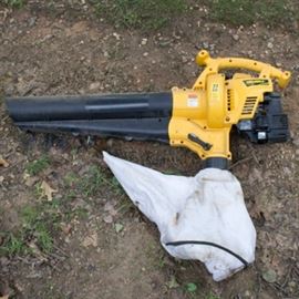 Yard-Man Leaf Blower: A gasoline powered Yard-Man leaf blower, Model number: GBV3100. This leaf blower features a 31cc 2-stroke engine and is reversible from blowing to vacuuming. Bag is included for use in vacuum mode.
