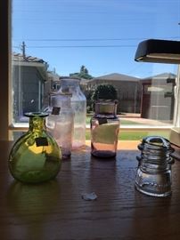 Clear glass that has turned purple due to sun exposure vases