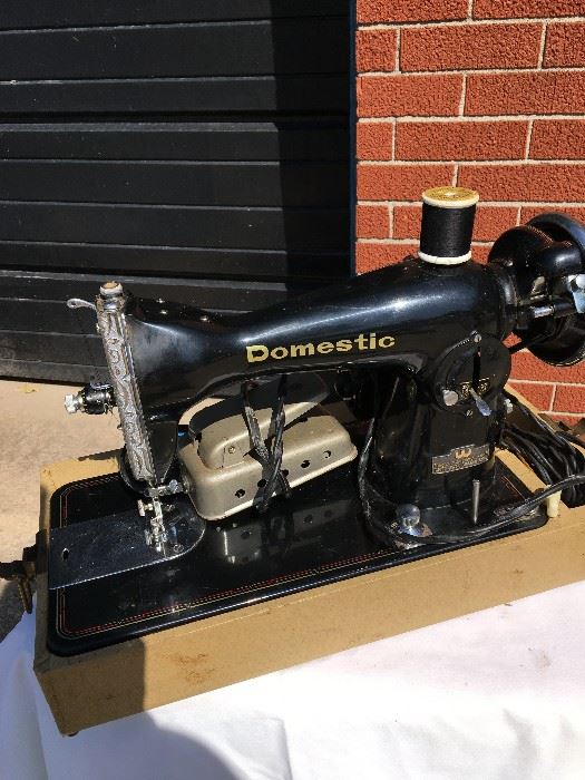 Antique White Co. sewing machine. Also has table.
