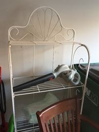 There is a pair of these fold up white iron bakers racks or plant stands