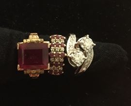 from left: 10kt gold garnet ring, ruby and diamond 14kt gold ring, 14kt white gold and diamond ring