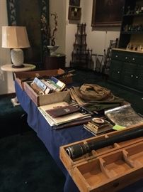 Military,spyglass, bayonets, license plated, frames photos, and other military items in the Living Room!