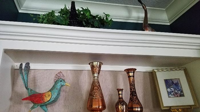 metal bird and brass vases