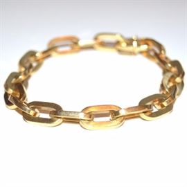18K Gold Chain Link Bracelet: An 18K gold chain link bracelet.
