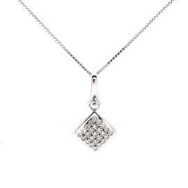 14K and 18K White Gold Diamond Necklace: A 14K and 18K white gold diamond necklace. This necklace features a 14K white gold diamond shaped pendant sprinkled with diamonds hanging from an 18K white gold box chain.
