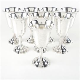 Set of International Sterling Co. Wine Goblets: A set of International Sterling Co. wine goblet. The set includes eight goblets in the Lord Saybrook pattern featuring a fluted rim and steam and circular tiered base. The underside of each goblets is marked, “International Sterling, Lord Saybrook.” The total approximate weight is 46.830 ozt.