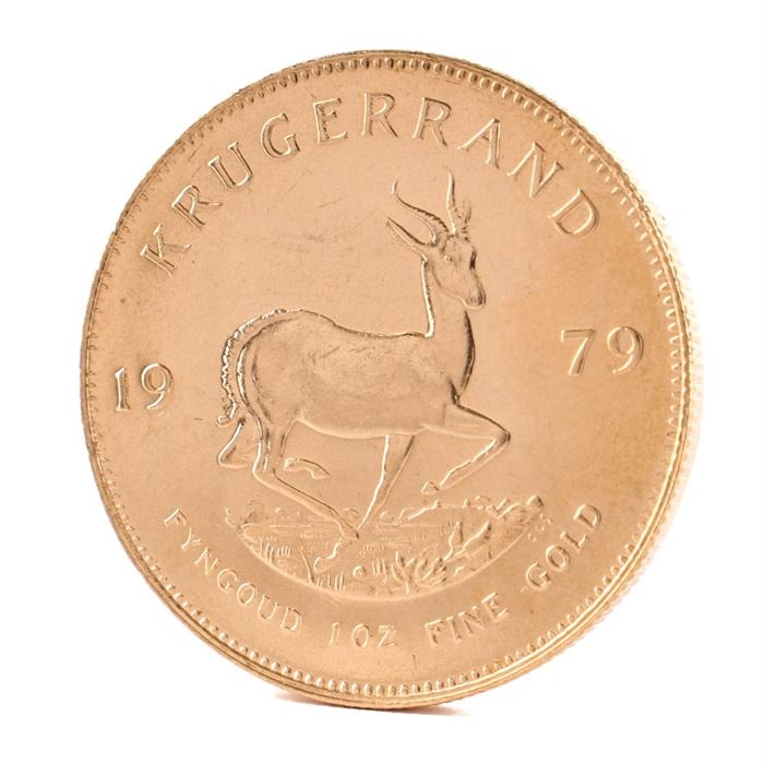 1979 South African 1 Ounce Fine Gold Krugerrand Coin: A 1979 South African 1 ounce fine gold Krugerrand. This coin, minted by the South African Mint and 32.80 mm in diameter, features the likeness of Paul Kruger, South Africa’s first president, along with “South Africa” in Afrikaans and English to obverse. The reverse displays the year of minting and gold weight along with the image of the national animal of South Africa, a Springbok antelope.