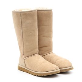 Ugg Australia Sand Classic Tall Boots: A pair of classic tall boots in sand by Ugg Australia. These boots feature sand colored suede outers with plush shearling lining and blown rubber soles.
