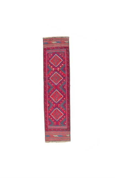 Hand-Knotted and Embroidered Baluch Tribal Runner: A hand-knotted and embroidered Baluch tribal runner. This wool rug is rendered in a palette of royal blue, cherry, camel, and gray. It features a vertical row of diamond medallions framed in a memling lattice. Enclosing the field are two box borders, including a primary border featuring a Baluch scrolling pattern over red. The rug is textured throughout, with embroidered embellishments and areas of flatweave. Top and bottom finish with embroidered kilim skirts. Selvedges are double overcast, while ends have short, camel-hair and wool warp fringe. Unlabeled.
