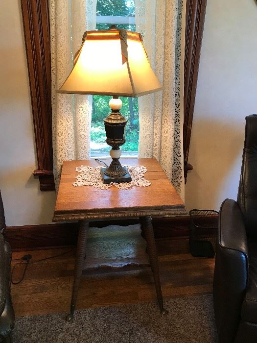 Oak side table with period lamp