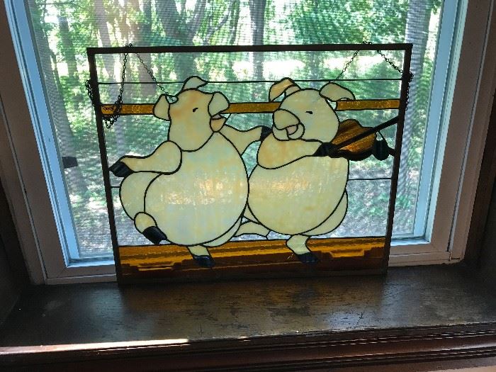 Unusual stain glass window - 2 pigs and a violin
