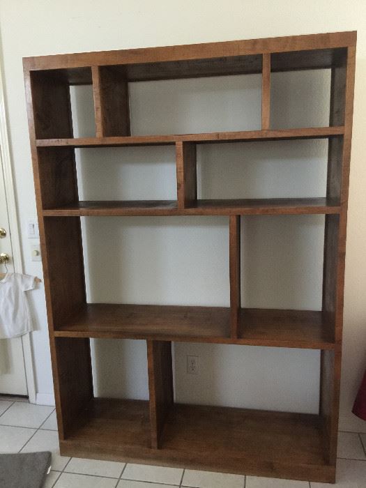 9 shelf/compartment bookcase   approx 55 inch wide  16 inch depth  79 inch height