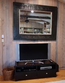 Samsung television and stand; large decorative mirror "America - Love Her or Saddle Up!
