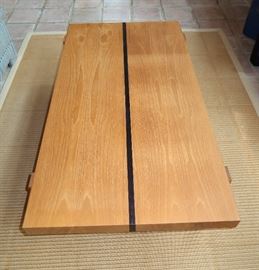 Ash rectangular coffee table with ebonized center stripe and banded legs; hand constructed by Bill Block