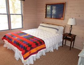 Cedar post queen bed with Pendleton blanket