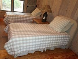 Pair of twin beds with natural linen headboards