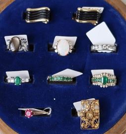 Gold rings of varied stones and onyx cuff links