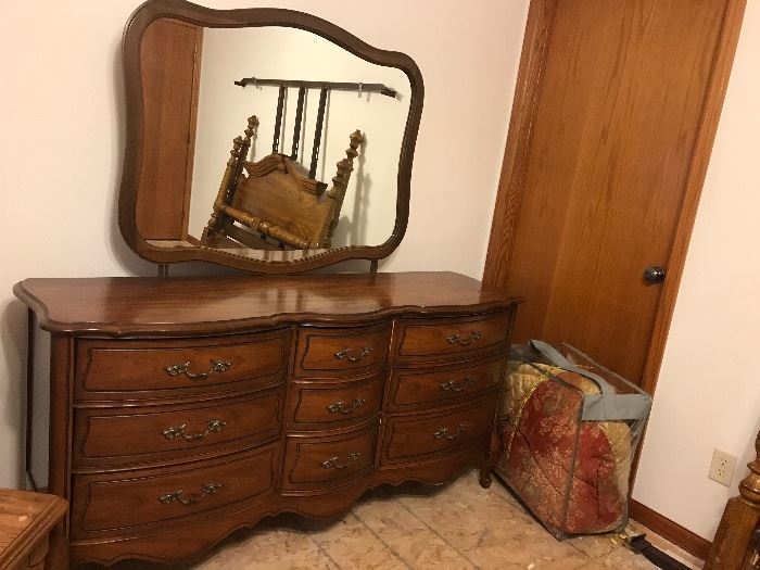 Beautiful dresser! The bed reflected is a queen size frame ! 