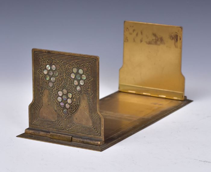 Tiffany Studios Folding Book Rack
Abalone pattern
14" x 6 1/4",  5 3/4" high
early 20th century