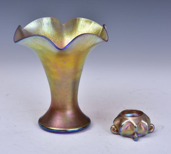 Tiffany Favrile Art Glass Vase
7 1/2" high, unsigned
together with a Tiffany Favrile
art glass salt, 3 1/4" diameter
signed "L.C.T. Favrile"