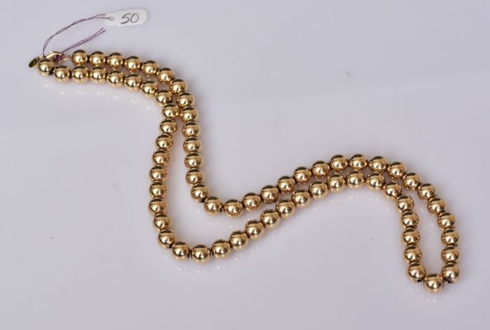 Tiffany 14k Gold Bead Necklace
24" long, 43.5 dwt
signed Tiffany & Co.