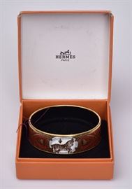 Hermes Enameled Cuff Bracelet
with horse and tassel
9" cuff , signed "Hermes, Paris
/Made in Austria" with original box