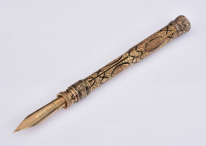 Edward Todd & Co 14K Gold Fountain Pen/Pencil
4" length collapsed,
4 3/4" length extended 
elaborately engraved with enameled
detail, with gemstone on tip of barrel
inscribed on nib, "Edward Todd & Co/
New York/5", circa 1880