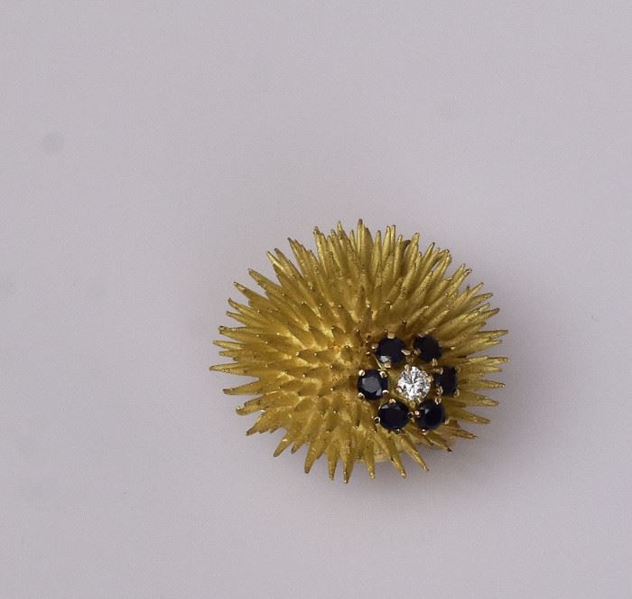 Tiffany & Co. 18k Gold Brooch
Sea Urchin
set with six sapphires and diamond
1 1/4" diameter, 11.3 dwt gross
signed "Tiffany & Co."