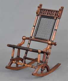 Hunzinger Webbed Rocking Chair
with Gothic Revival crest
35 1/2" high
circa 1885