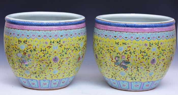 Chinese Porcelain Pair of Jardinieres
decorated with flowers on a yellow ground
each 13 1/2" high, 15 1/2" diameter