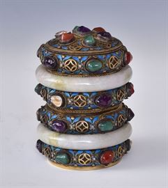 Chinese Enameled Gilt Silver Canister
enameled with semi precious stones
and two jade rings, 4 1/2" high
stamped "silver" on base