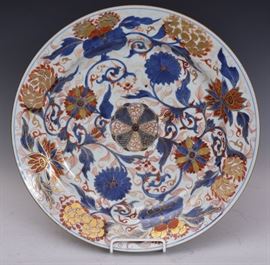 Chinese Porcelain Charger
with gilt decorated blue and red
floral motif, 15" diameter
probably 18th century