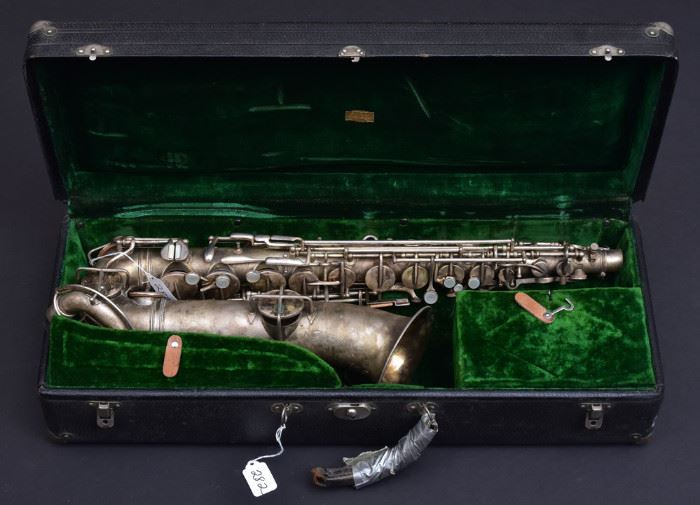 Holton Elkhorn Saxophone
mother of pearl keys, engraved on bell
27" long, with hard case
early 20th century
